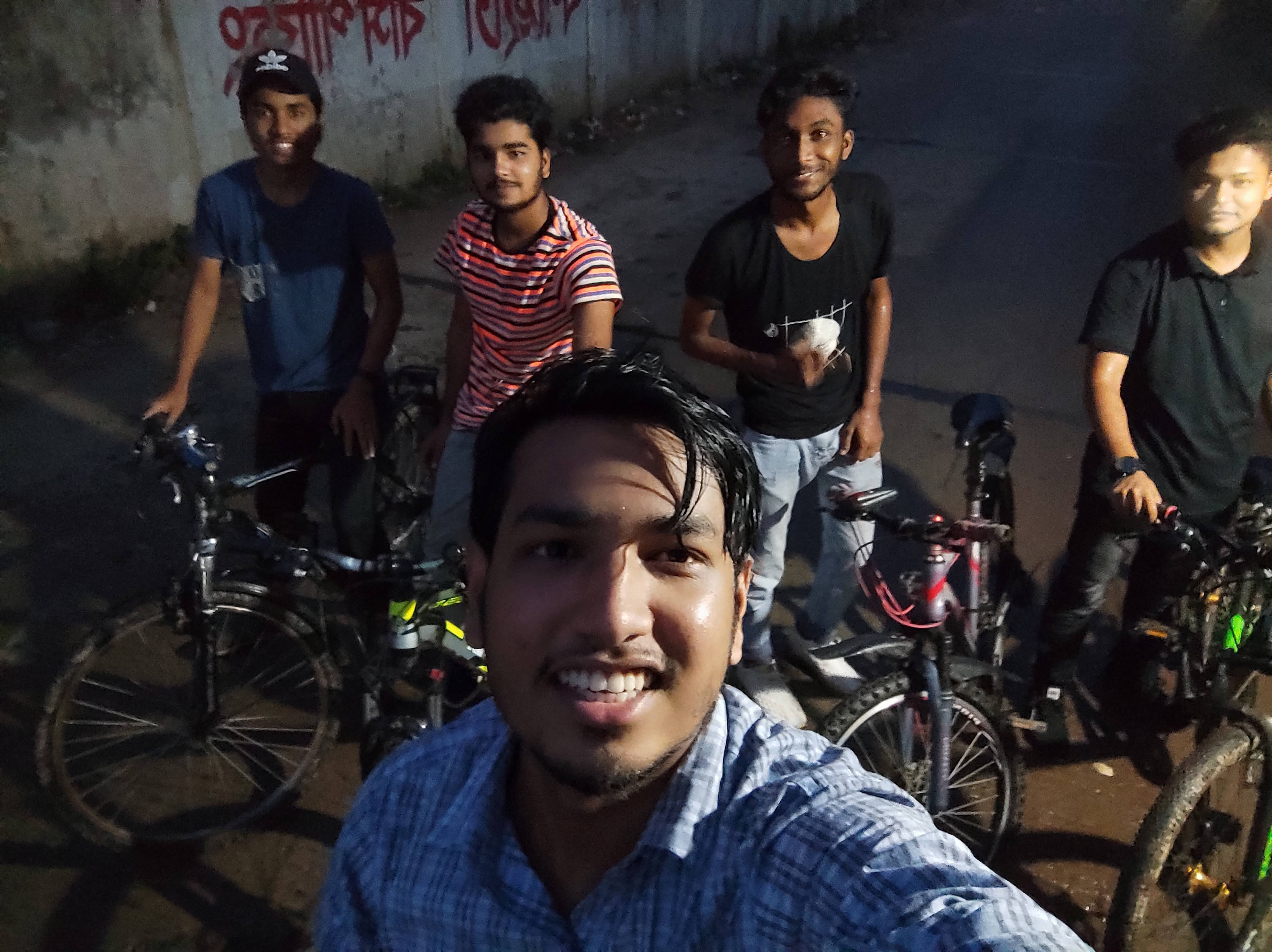 Cycling group under a flower gate